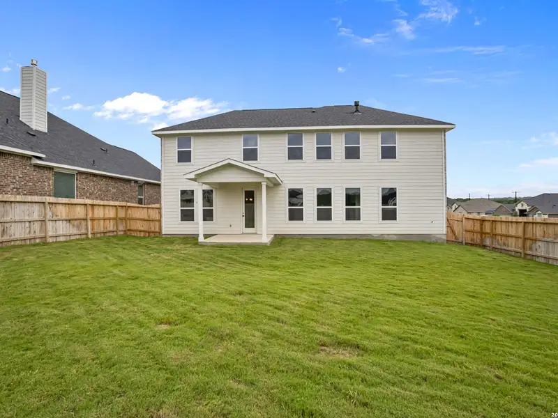 Exterior details and patio area of a home in The Reserve at Potranco Oaks, Castroville (Image 4).