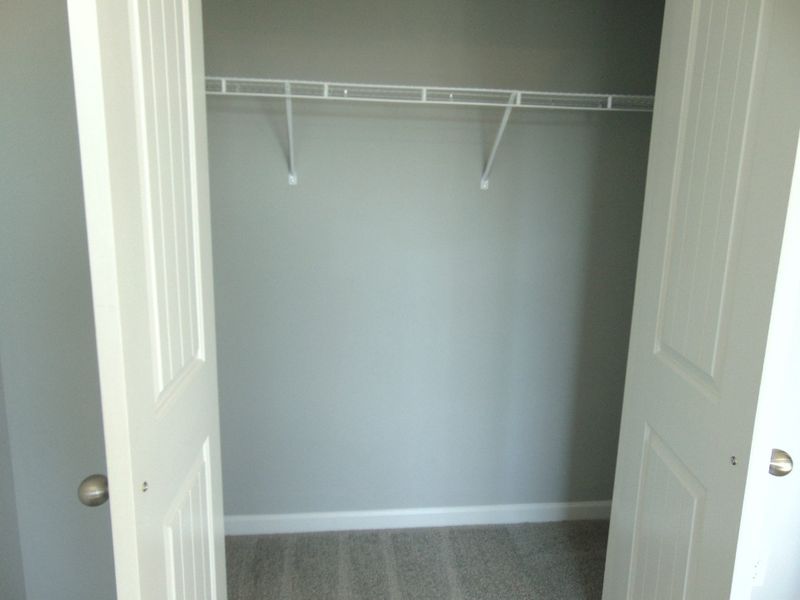 The second bedroom with large windows for that nature lighting, as well as your closet as well as a convenient rack. The second bedroom with large windows for that nature lighting, as well as your closet as well as a convenient rack.