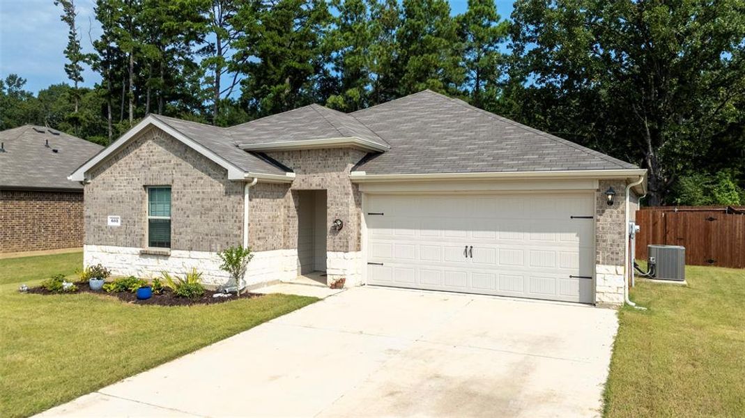 Front exterior of a new home in , Chandler, TX, highlighting curb appeal (Image 2). Front exterior of a new home in , Chandler, TX, highlighting curb appeal (Image 2).