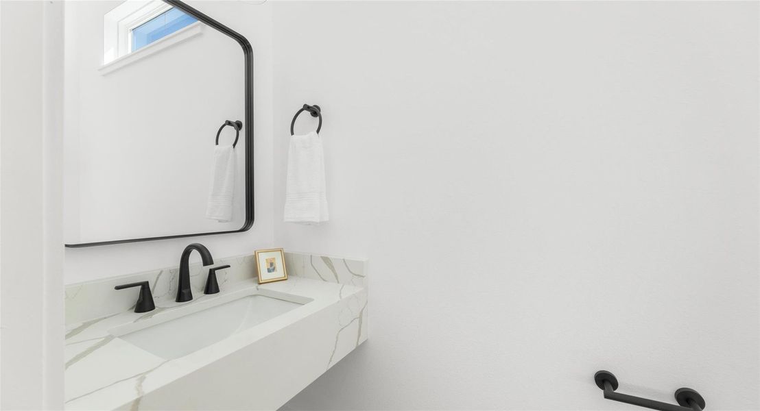 A double-vanity bath in a clean, contemporary palette that makes everyday routines feel a little more luxurious. Model No. 105 Shown.