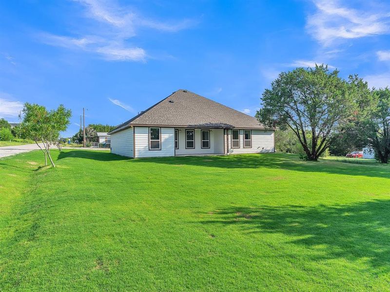 Front exterior of a new home in , Granbury, TX, highlighting curb appeal (Image 22). Front exterior of a new home in , Granbury, TX, highlighting curb appeal (Image 22).