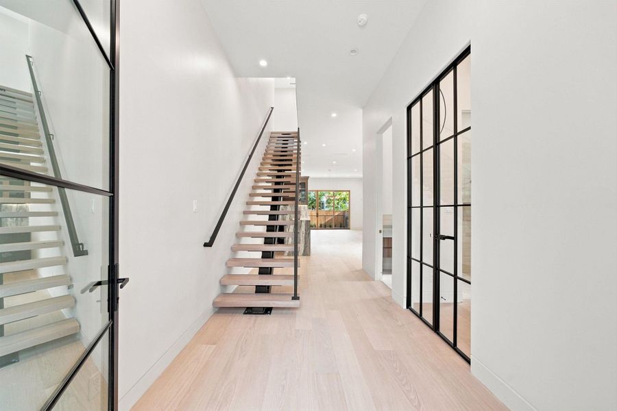 The home features soaring ceilings and amazing natural light throughout.