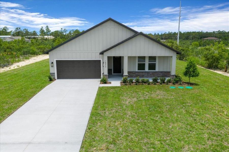 Front exterior of a new home in , Weeki Wachee, FL, highlighting curb appeal (Image 2). Front exterior of a new home in , Weeki Wachee, FL, highlighting curb appeal (Image 2).