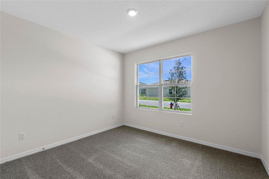 Spacious, unfurnished interior of a new home in Harmony at Lake Eloise, Winter Haven (Image 19).