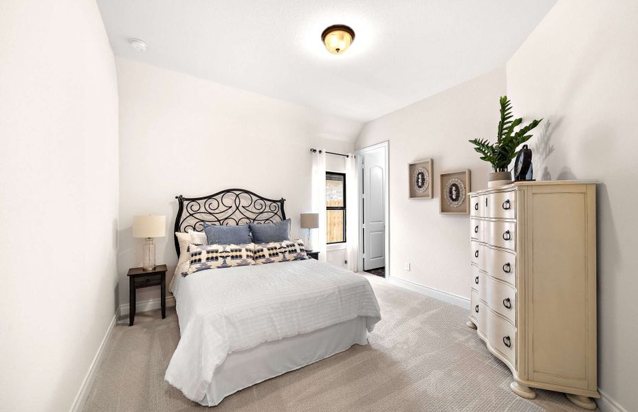 Representative furnished interior of a home built from the 2855 by Ravenna Homes in The Woodlands Hills 65′, Willis (Image 40).