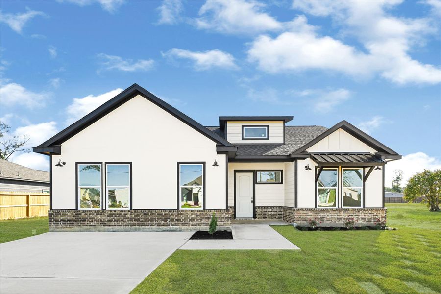 Front exterior of a new home in , Huffman, TX, highlighting curb appeal (Image 1). Front exterior of a new home in , Huffman, TX, highlighting curb appeal (Image 1).