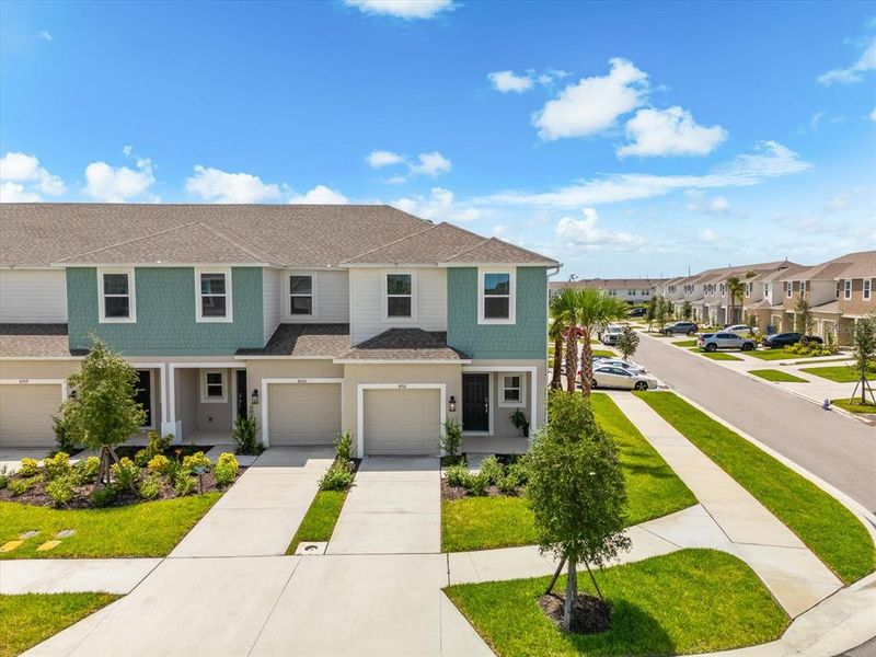 Front exterior of a new home in , Sarasota, FL, highlighting curb appeal (Image 27).