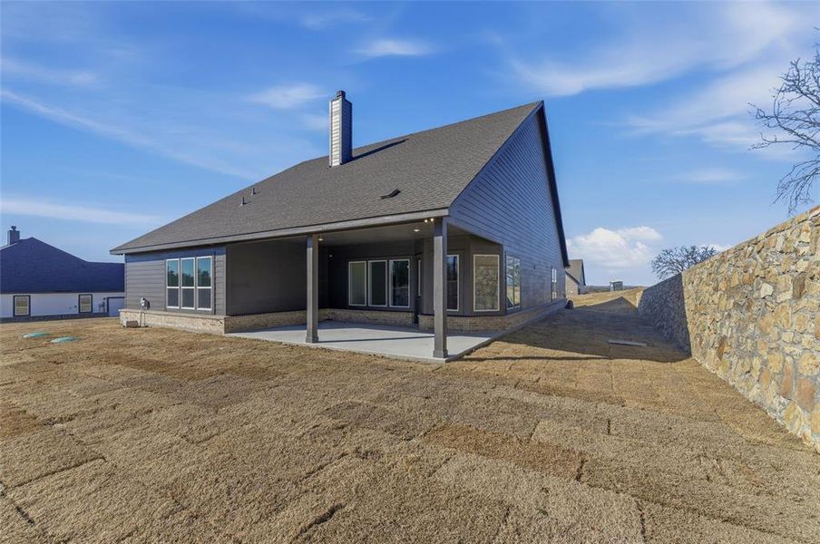 Exterior details and patio area of a home in Oak Grove Addition, Springtown (Image 24).