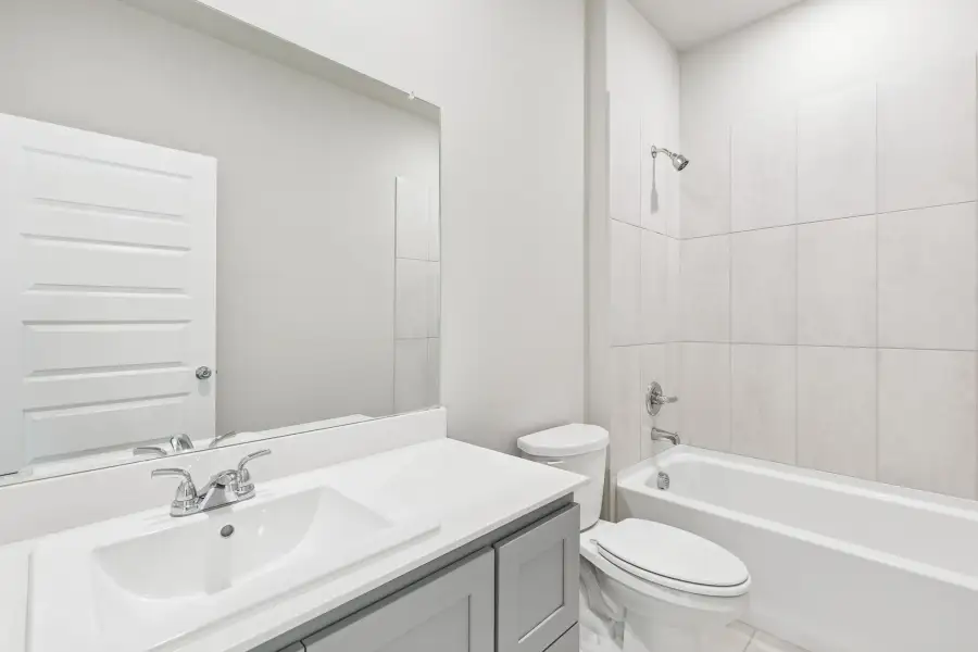Bathroom in the Haylee home plan by Trophy Signature Homes - REPRESENTATIVE PHOTO