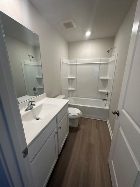 Furnished interior view inside a new home in Sweetwater Ridge, Conroe (Image 3).