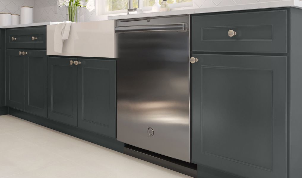 Kitchen with white fire-clay apron front sink and stainless appliances