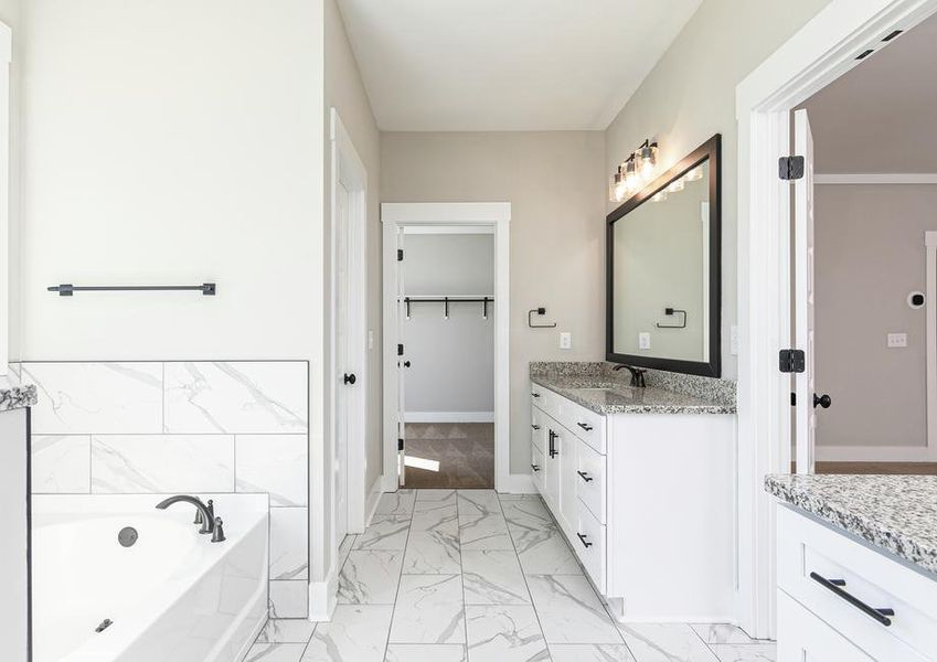 Master bath with a tub.