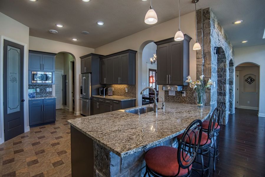 Representative furnished interior of a home built from the Kennedy by Windmiller Custom Homes in The Highlands, Northlake (Image 5).