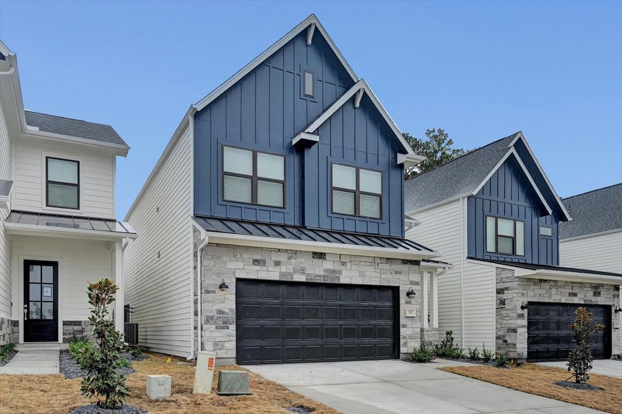 Front exterior of a new home in Summer Place 35', Montgomery, TX, highlighting curb appeal (Image 2). Front exterior of a new home in Summer Place 35', Montgomery, TX, highlighting curb appeal (Image 2).