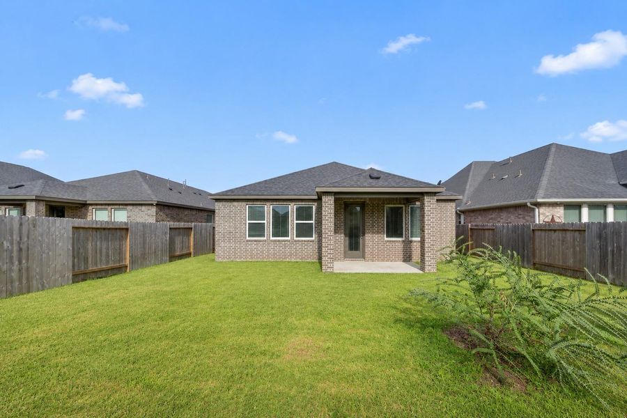 Exterior details and patio area of a home in Morgan's Landing 50s, La Porte (Image 25).