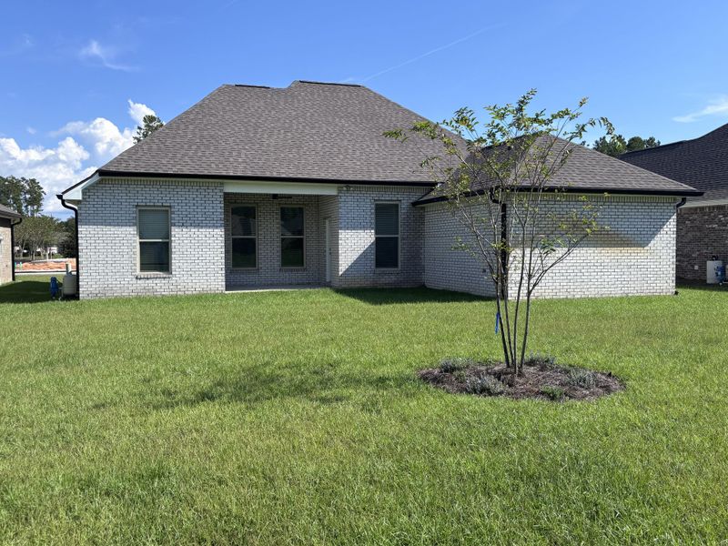 Exterior details and patio area of a home in Bird Song at Hammock Bay, Freeport (Image 20).
