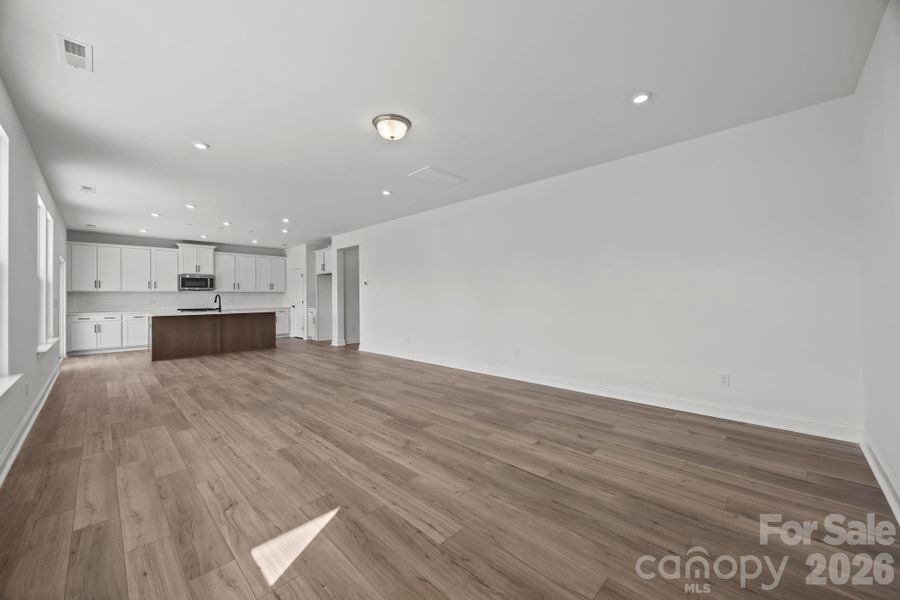 Family Room Looking Into KitchenPhotos are representative and may not reflect the exact home, finishes, or features.