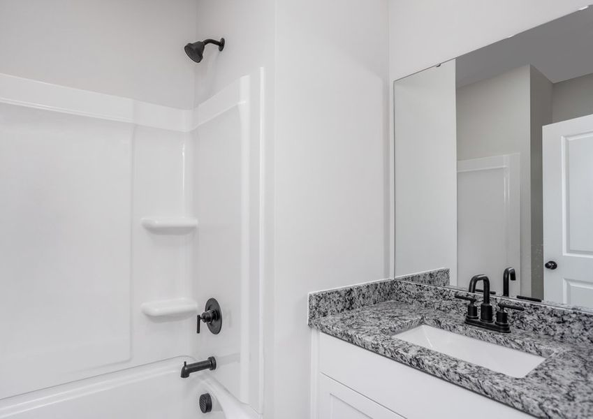 Secondary bathroom has a soaking tub