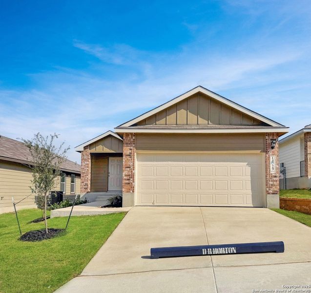 Front exterior of a new home in Stonehill, San Antonio, TX, highlighting curb appeal (Image 1). Front exterior of a new home in Stonehill, San Antonio, TX, highlighting curb appeal (Image 1).