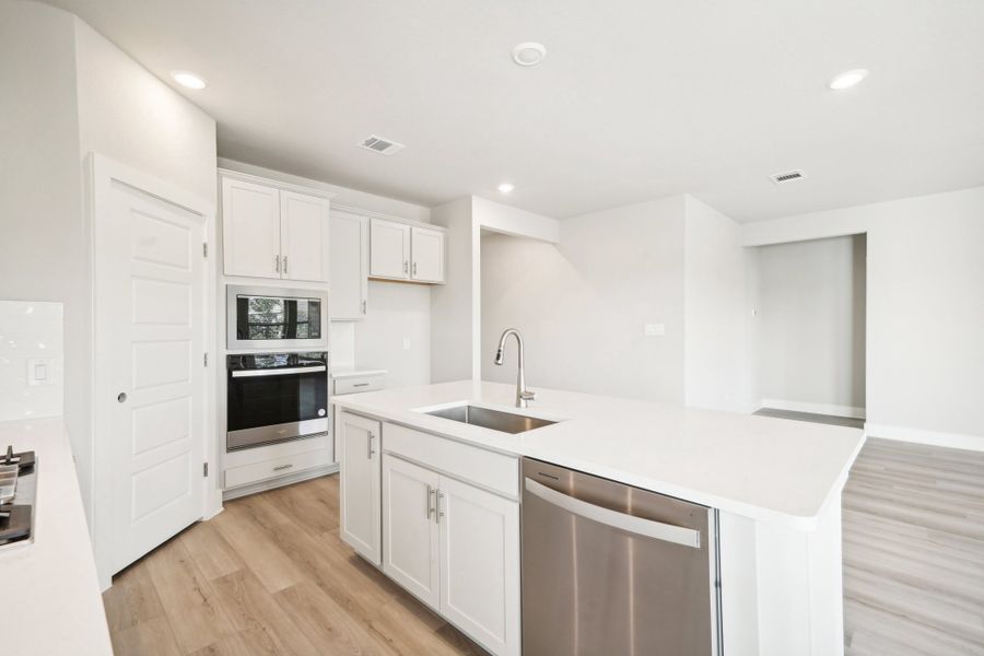 Kitchen in the Preston floorplan at a Meritage Homes community.