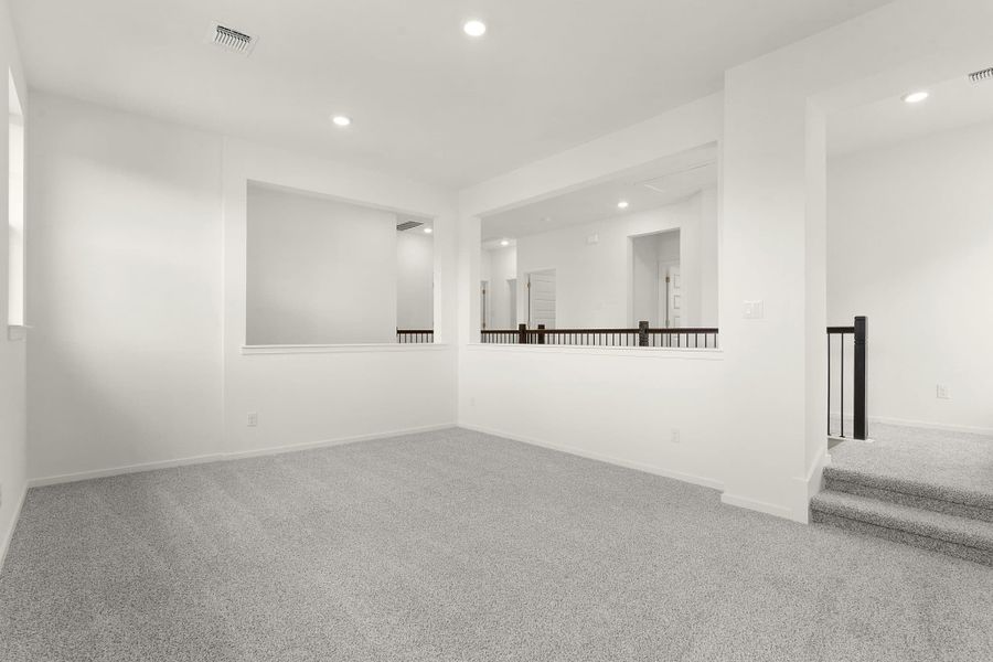 Representative unfurnished interior of a home built from the Maeve by Chesmar Homes in Deerbrooke Cottages, Leander (Image 14).