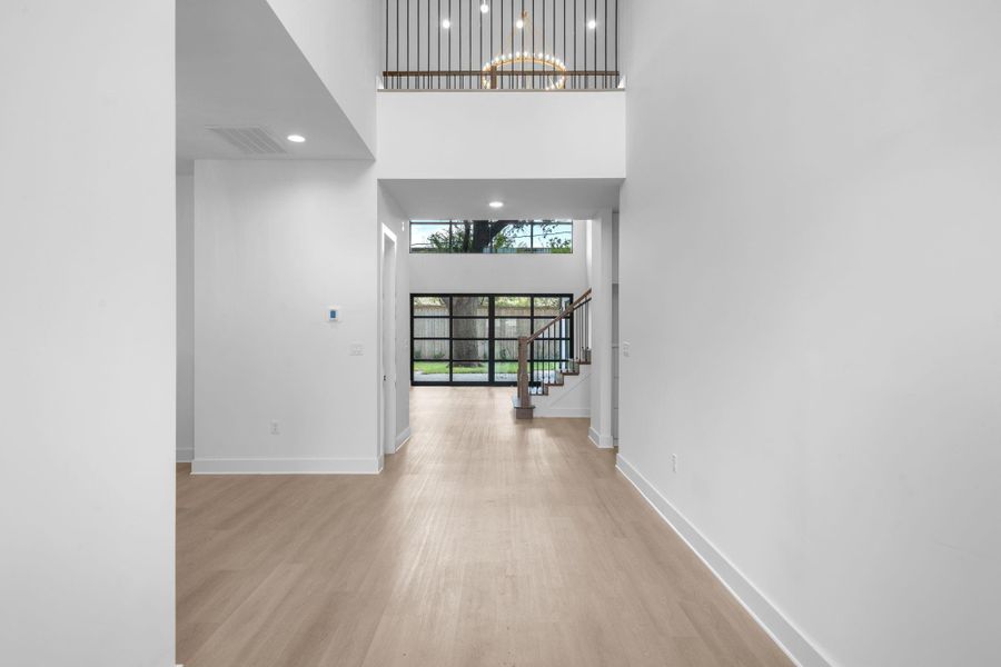 Welcome home! This amazing entry with soaring ceilings, stunning engineered wood floors, incredible staircase, and incredible views straight into your backyard. Welcome home! This amazing entry with soaring ceilings, stunning engineered wood floors, incredible staircase, and incredible views straight into your backyard.