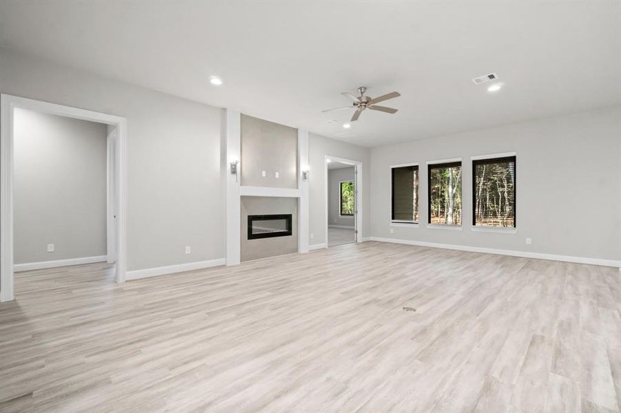 Spacious family room with expansive windows.