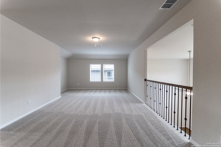 Spacious, unfurnished interior of a new home in The Woodlands at Medina Hills, Mico (Image 17).