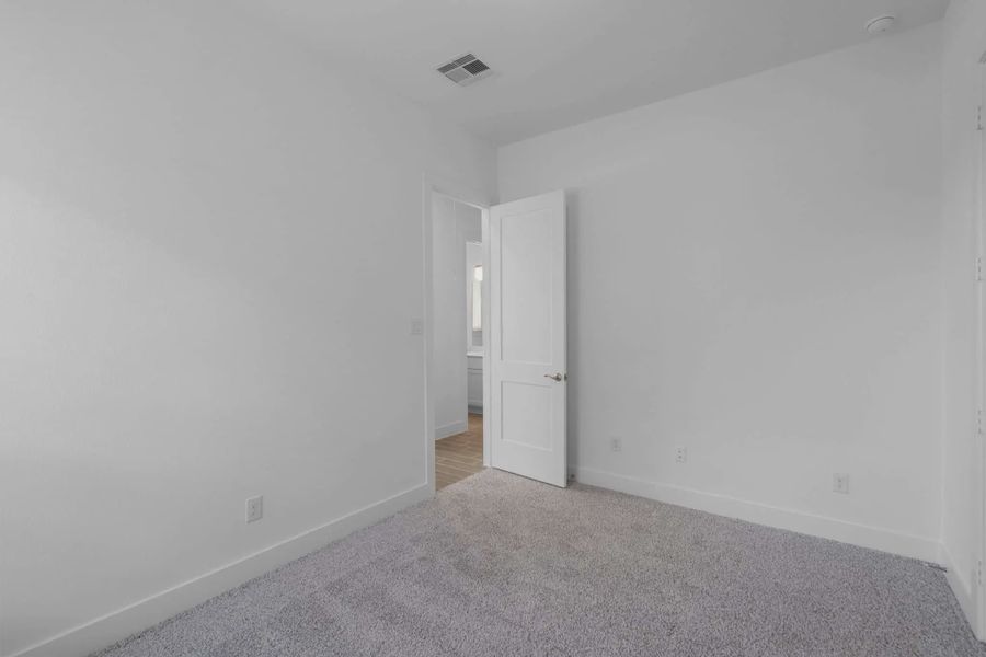Representative unfurnished interior of a home built from the Mickelson by Chesmar Homes in Riceland Alley Loads, Mont Belvieu (Image 88).