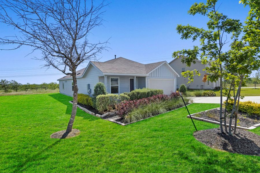 Front exterior of a new home in Schriber Ranch, Mustang Ridge, TX, highlighting curb appeal (Image 25).