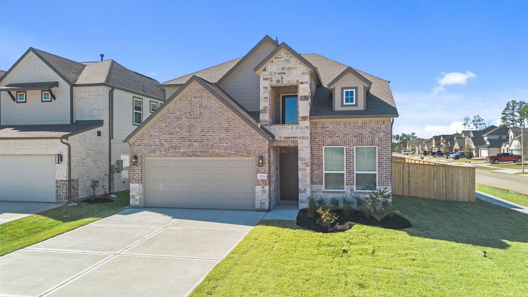 Front exterior of a new home in Barton Creek Ranch, Conroe, TX, highlighting curb appeal (Image 17). Front exterior of a new home in Barton Creek Ranch, Conroe, TX, highlighting curb appeal (Image 17).