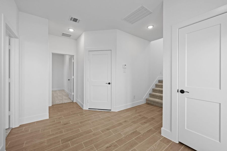 Spacious, unfurnished interior of a new home in Sienna, Missouri City (Image 13). Spacious, unfurnished interior of a new home in Sienna, Missouri City (Image 13).