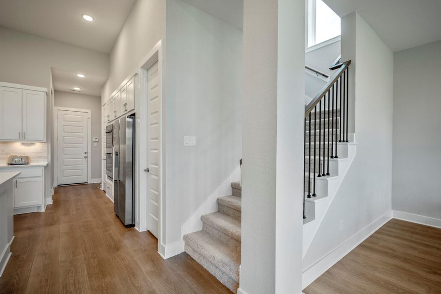 This smart floor plan makes everyday living easy with a private study, island kitchen, open family and dining areas, two first-floor suites, powder bathroom and utility room downstairs. Upstairs, it’s all fun and games with a spacious game room, media room, two additional bedrooms and a Hollywood-style bathroom.