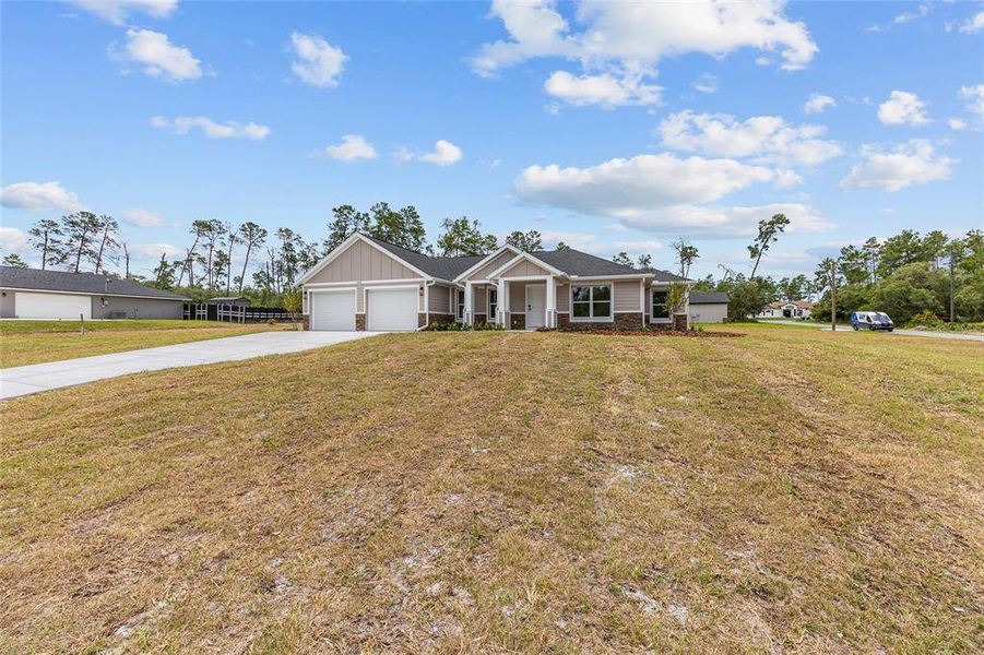 Front exterior of a new home in , Dunnellon, FL, highlighting curb appeal (Image 23). Front exterior of a new home in , Dunnellon, FL, highlighting curb appeal (Image 23).