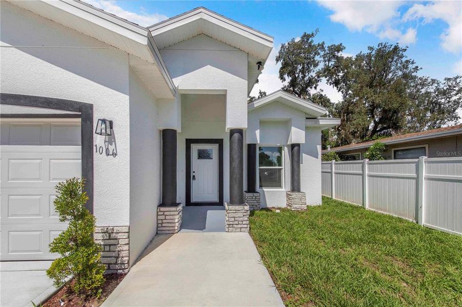 Front exterior of a new home in , Haines City, FL, highlighting curb appeal (Image 16).