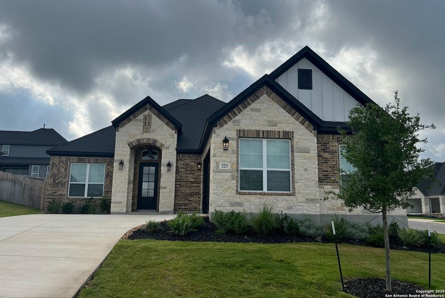 Front exterior of a new home in , Castroville, TX, highlighting curb appeal (Image 17). Front exterior of a new home in , Castroville, TX, highlighting curb appeal (Image 17).