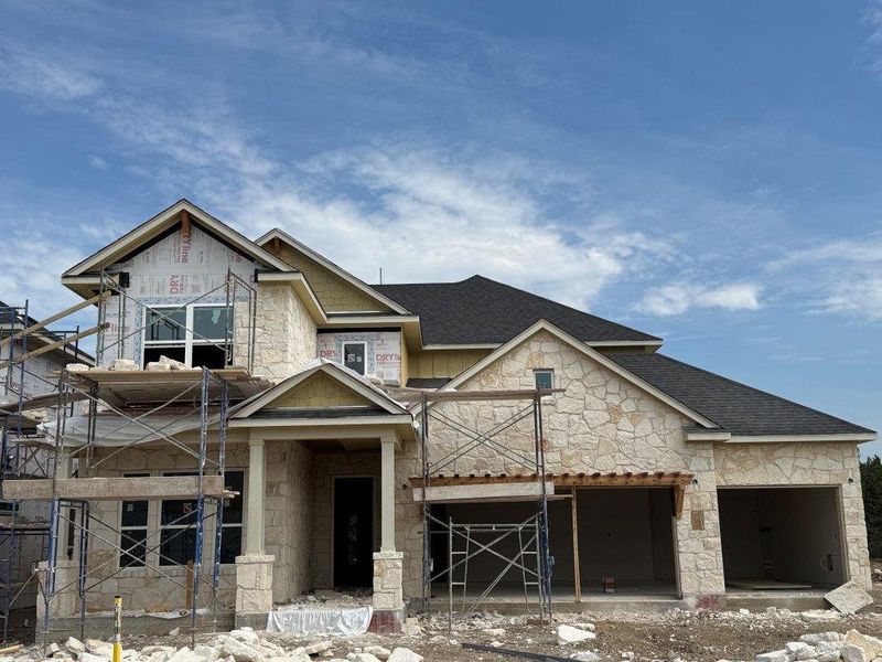 Front exterior of a new home in Barksdale, Leander, TX, highlighting curb appeal (Image 2). Front exterior of a new home in Barksdale, Leander, TX, highlighting curb appeal (Image 2).