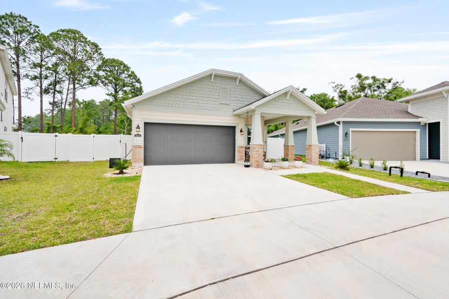 Front exterior of a new home in Concourse Crossing, Fernandina Beach, FL, highlighting curb appeal (Image 24).