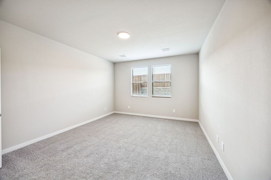 Primary Suite in the Willow home plan by Trophy Signature Homes – REPRESENTATIVE PHOTO