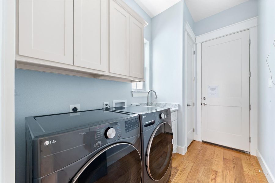 Utility Room with furnished washer dryer, sink & mudroom