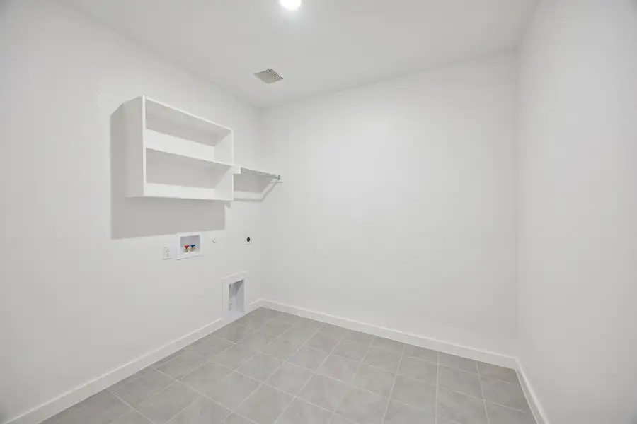 Utility Room in the Wimbledon home plan by Trophy Signature Homes – REPRESENTATIVE PHOTO Utility Room in the Wimbledon home plan by Trophy Signature Homes – REPRESENTATIVE PHOTO