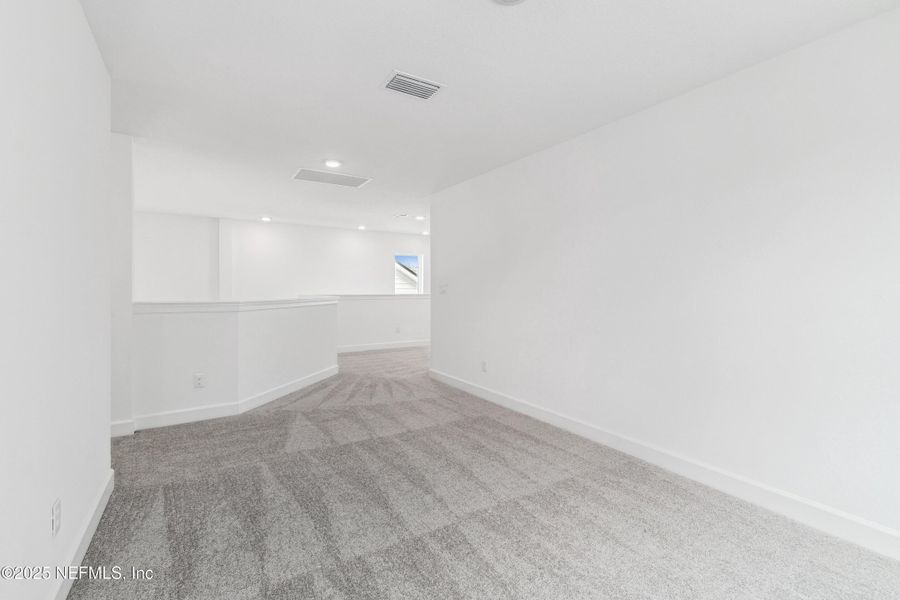 Spacious, unfurnished interior of a new home in Evergreen Island at Silverleaf - Classic, St. Augustine (Image 14).