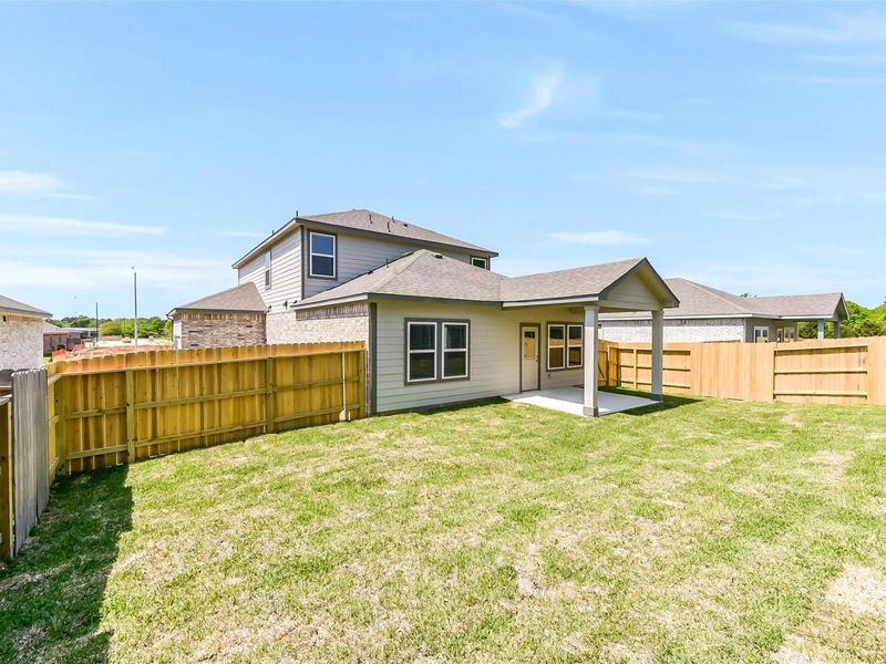 Exterior details and patio area of a home in Windmill Estates, Magnolia (Image 30).