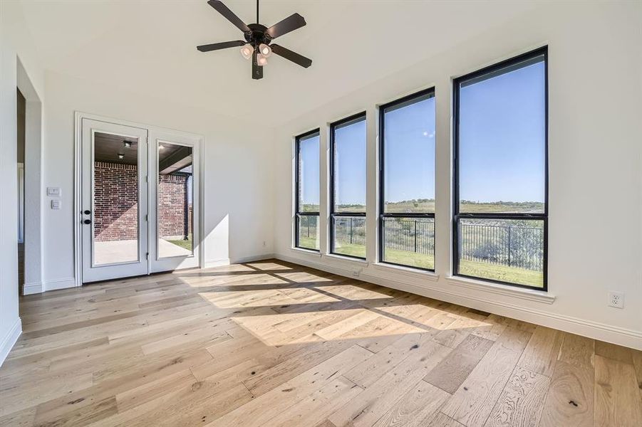 Spare room featuring ceiling fan and light hardwood / wood-style flooring