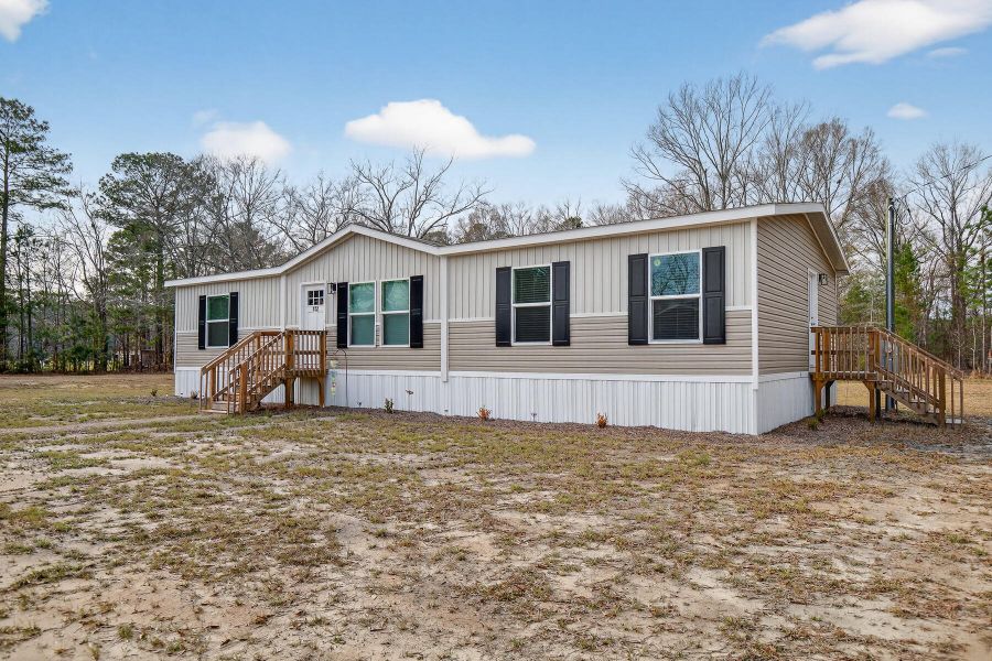 Exterior details and patio area of a home in , Vance (Image 29).