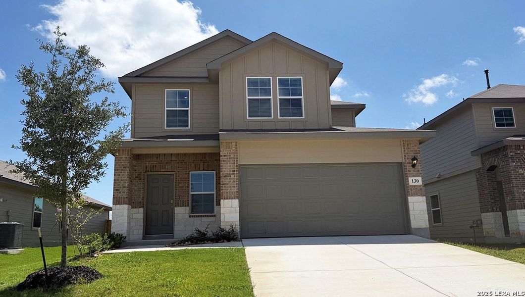 Front exterior of a new home in Redbird Ranch, San Antonio, TX, highlighting curb appeal (Image 2).