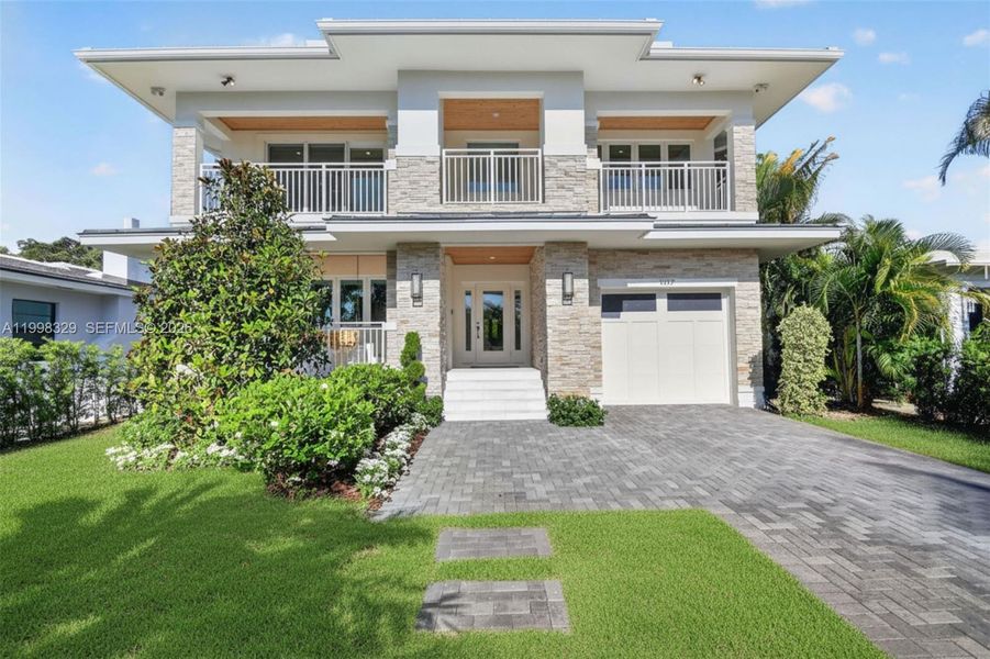 Front exterior of a new home in , Lake Worth, FL, highlighting curb appeal (Image 27).