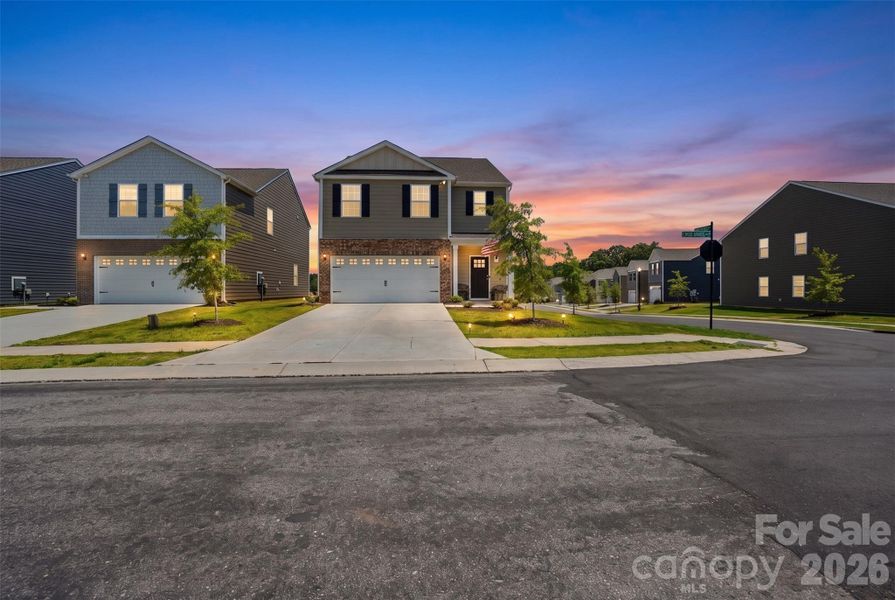 Front exterior of a new home in Fergus Crossing, York, SC, highlighting curb appeal (Image 25). Front exterior of a new home in Fergus Crossing, York, SC, highlighting curb appeal (Image 25).