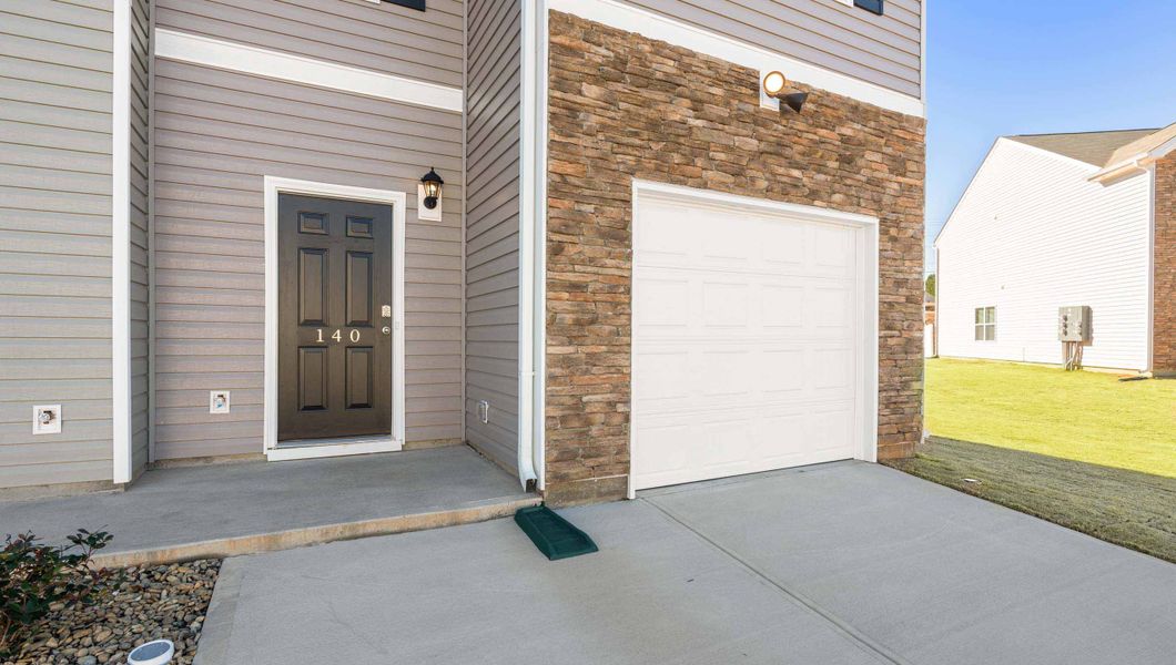 Front exterior of a new home in Tanglewood Townes, Greenville, SC, highlighting curb appeal (Image 2).