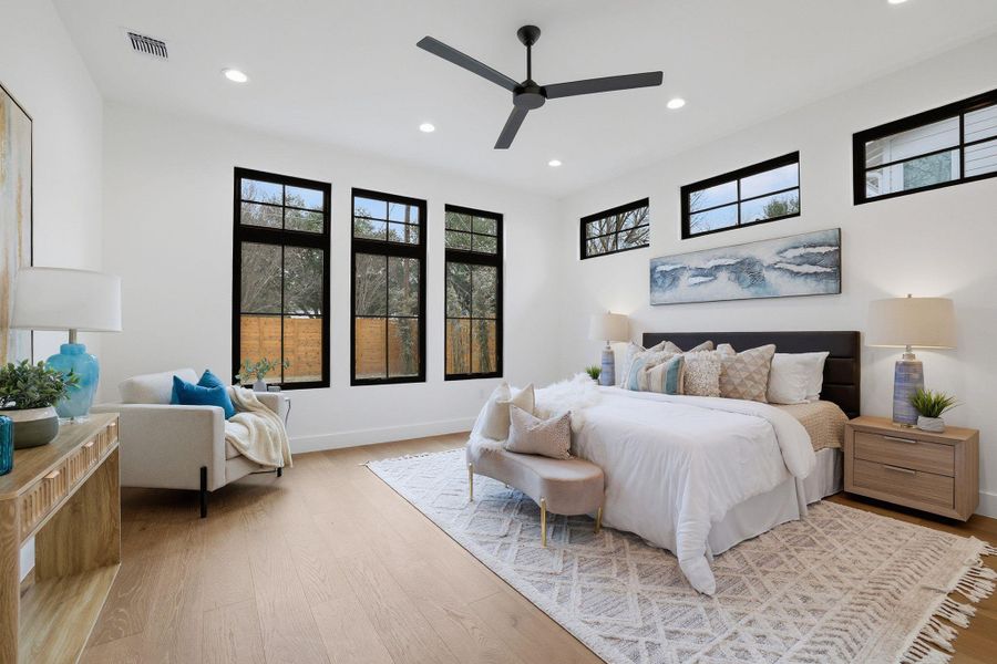 Bedroom featuring light wood-style floors, recessed lighting, and ceiling fan